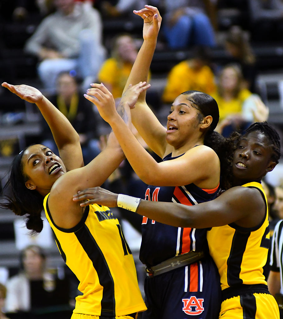 Missouri's Nadia Green and Amber Smith defends against Auburn's Erin Howard